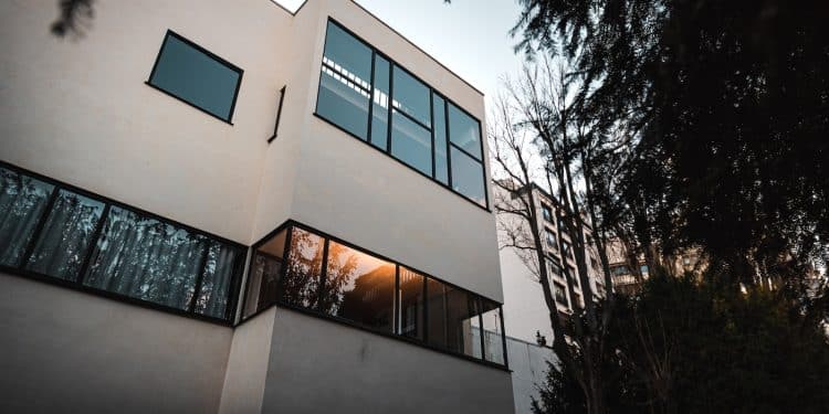 brown concrete building near trees during daytime